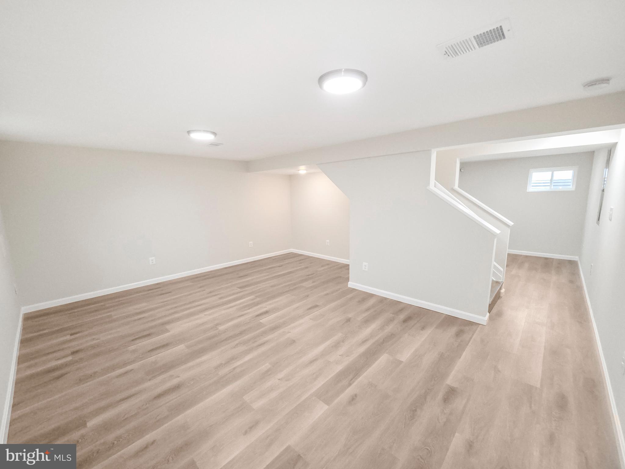 6516 Columbia Park Road Landover, MD 20785 - Photo 17 of 25 a view of empty room with wooden floor