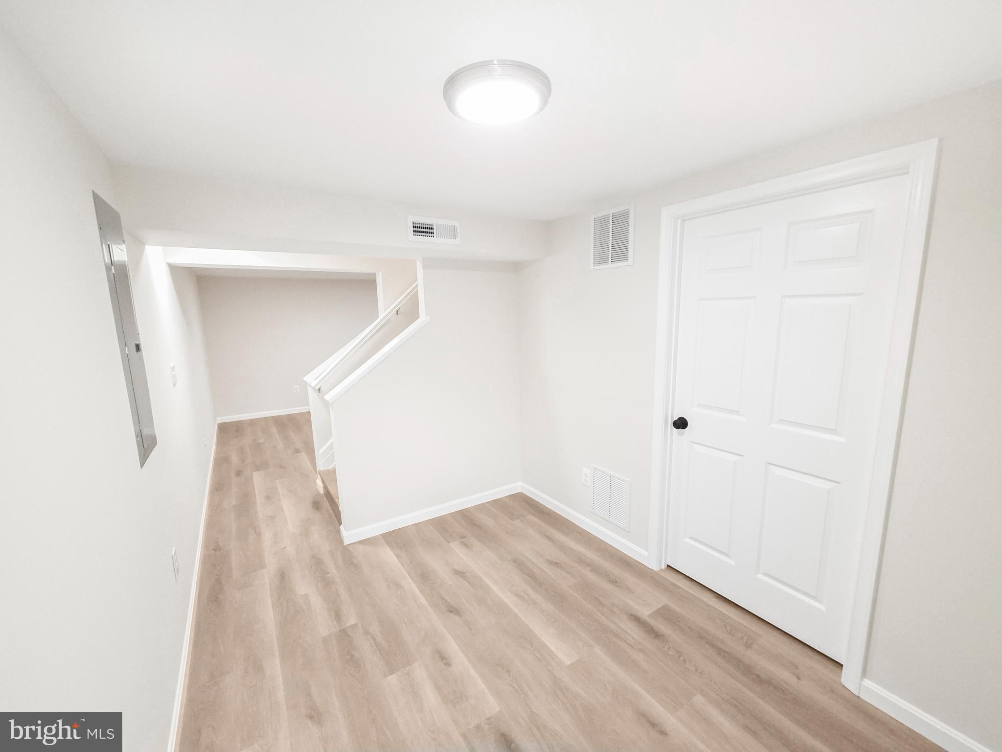 6516 Columbia Park Road Landover, MD 20785 - Photo 19 of 25 a view of hallway with wooden floor
