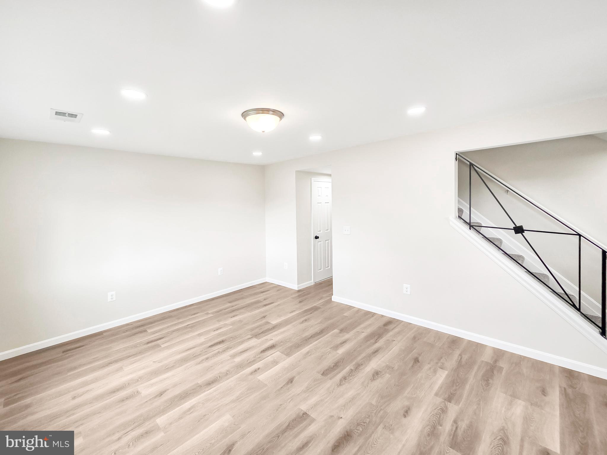6516 Columbia Park Road Landover, MD 20785 - Photo 3 of 25 a view of empty room with wooden floor