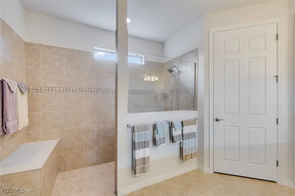 a bathroom with a bathtub and shower