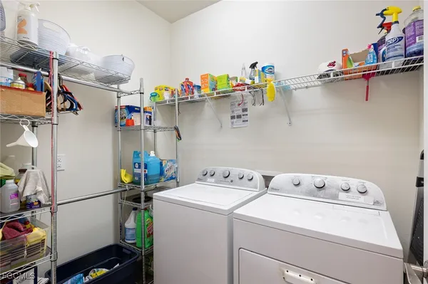 a utility room with dryer and washer