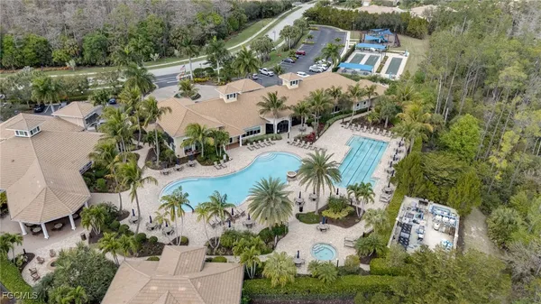 an aerial view of residential house with outdoor space and swimming pool