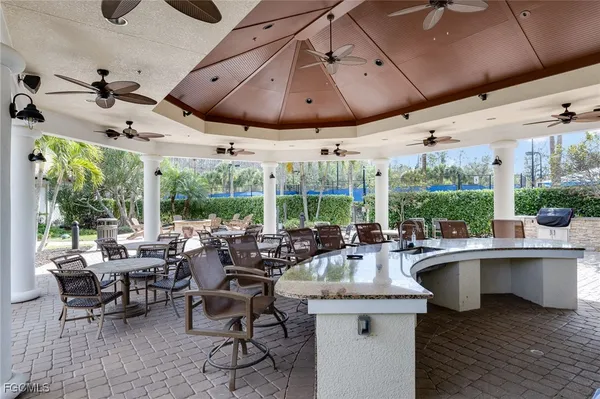 a view of a patio with a table and chairs