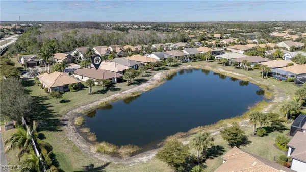 an aerial view of a house with a yard
