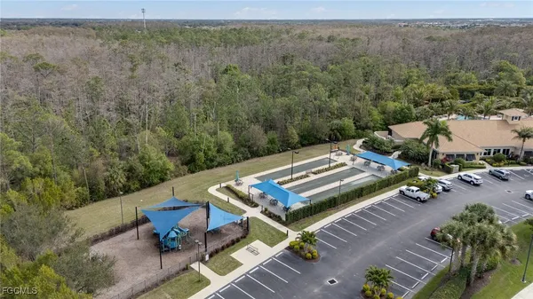 an aerial view of a house with pool