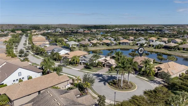 an aerial view of a house with lake view
