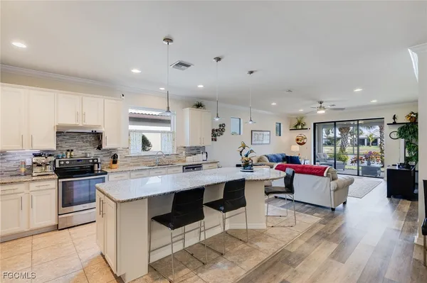 a large kitchen with a table and chairs in it
