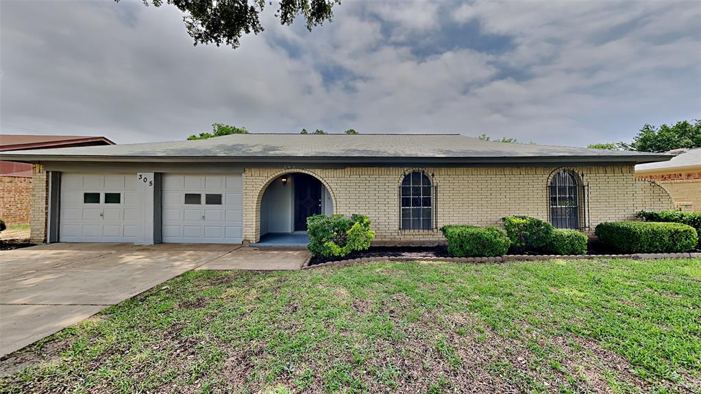 305 Georgetown Drive Everman, TX 76140 - Photo 1 of 1 a front view of house with yard and green space