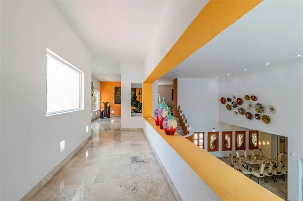 a view of a living room and entryway