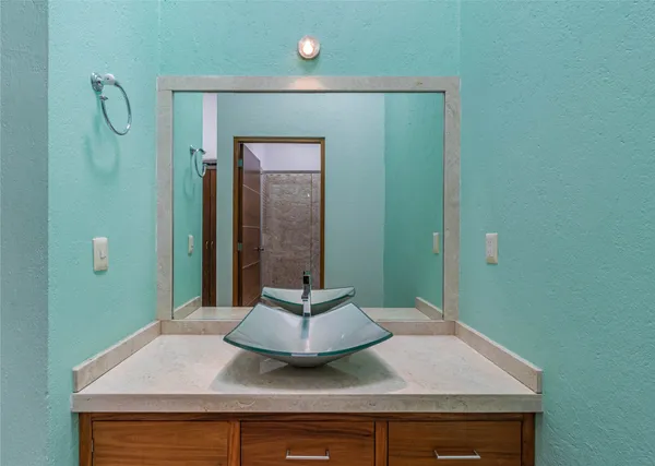 a bathroom with a toilet and shower
