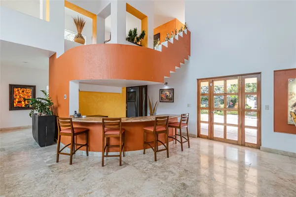 a kitchen with a stove and a refrigerator