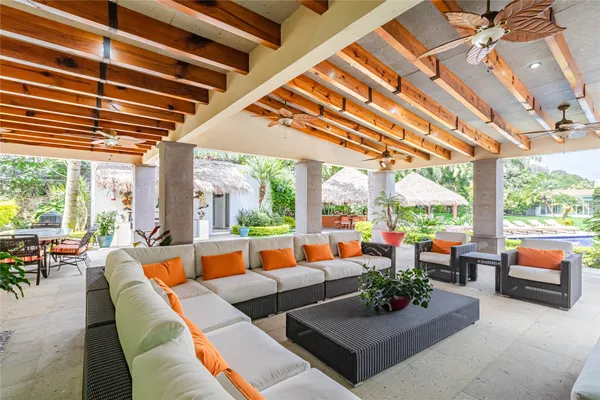 a view of an outdoor dining space with a table and chairs