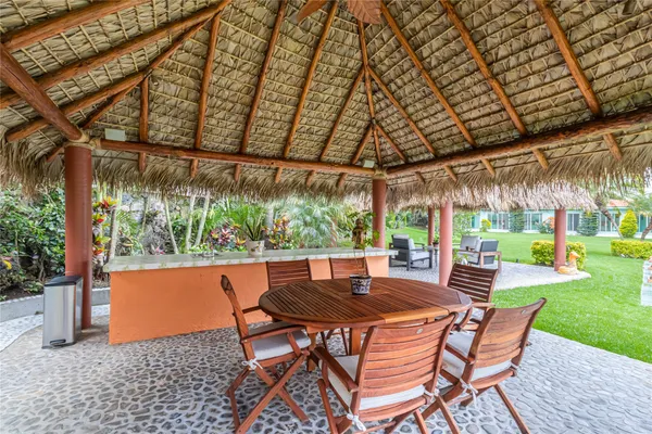 a view of patio with swimming pool