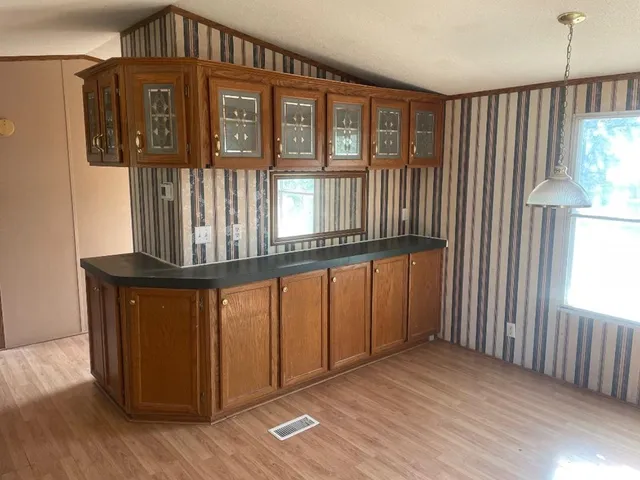 a view of a entryway door with wooden floor