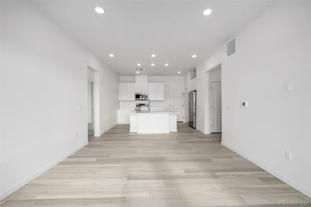 a view of kitchen with wooden floor