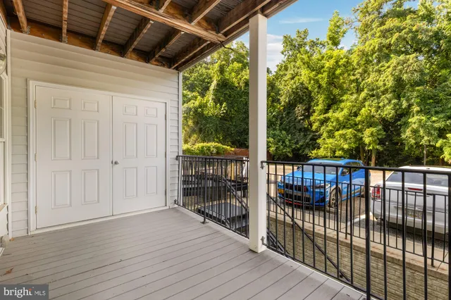 a view of balcony with wooden floor