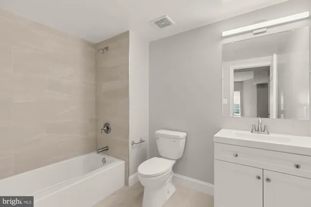 a bathroom with a sink toilet and bathtub