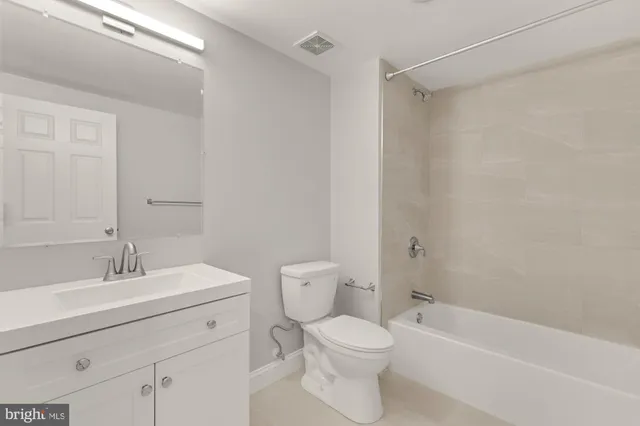a bathroom with a toilet a sink and a bathtub