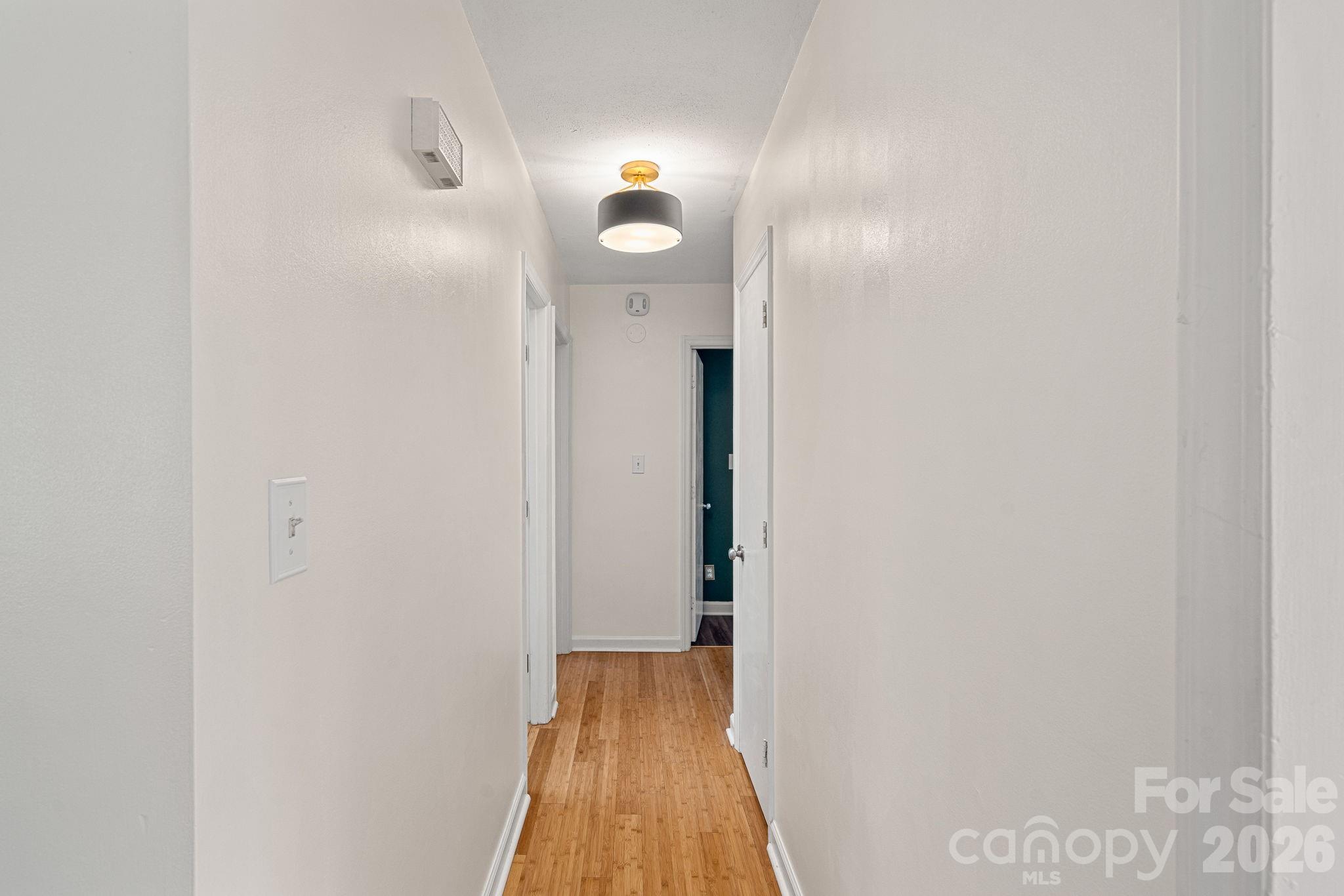 5236 Auburndale Road Charlotte, NC 28205 - Photo 11 of 26 a view of a hallway with wooden floor