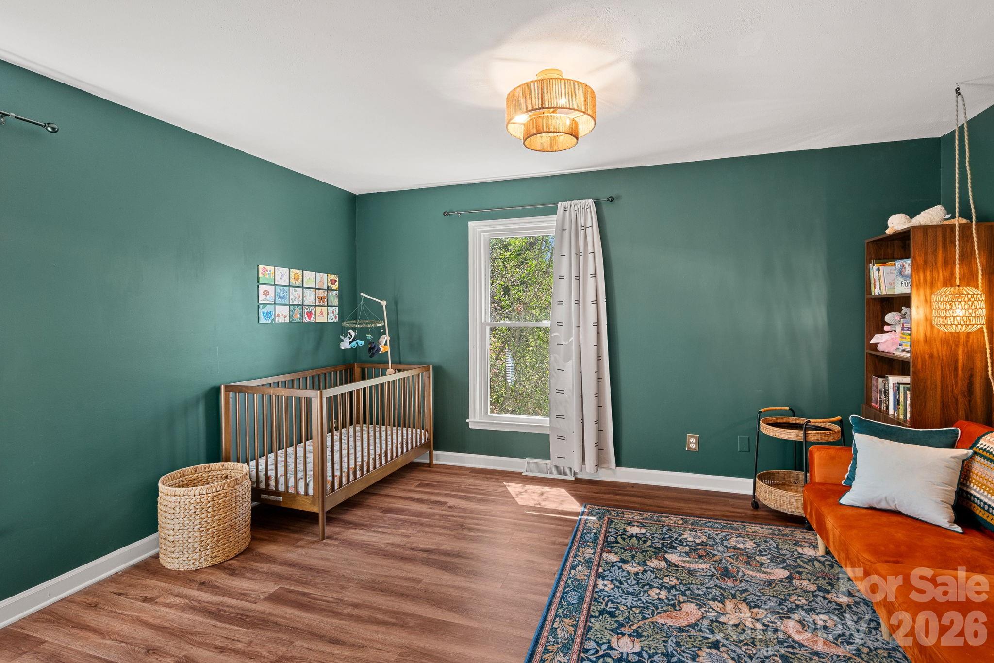 5236 Auburndale Road Charlotte, NC 28205 - Photo 16 of 26 a bedroom with furniture and a window