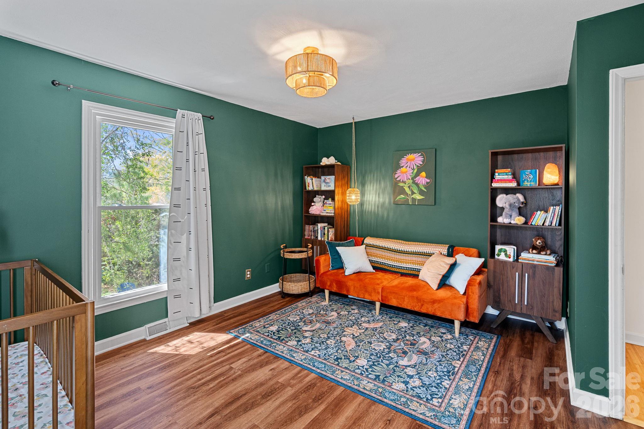 5236 Auburndale Road Charlotte, NC 28205 - Photo 17 of 26 a living room with blue lights with furniture and rug