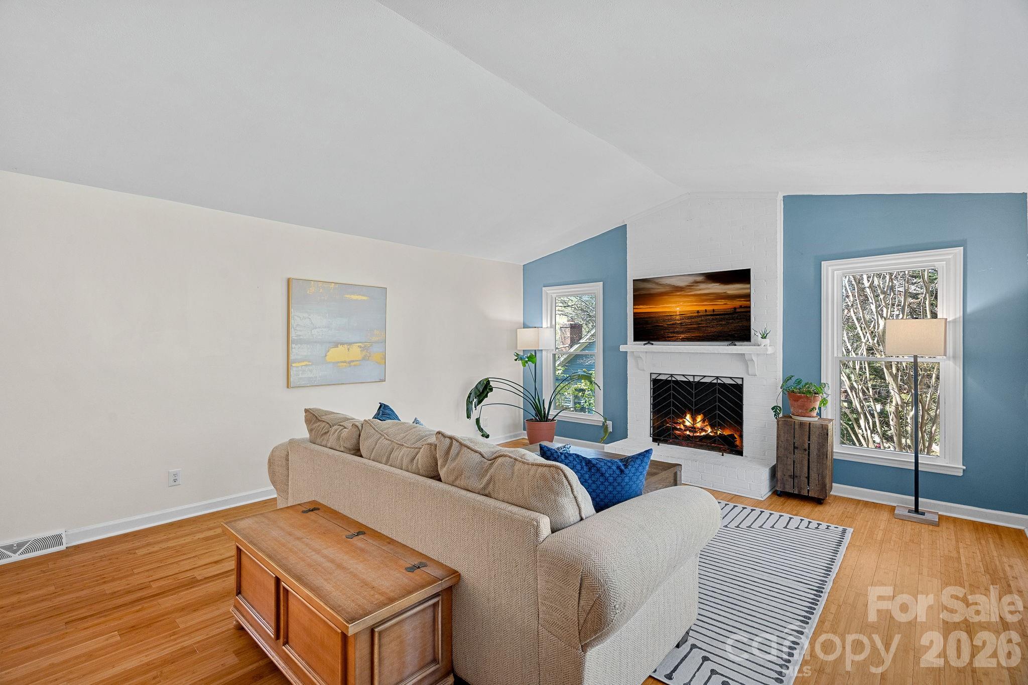 5236 Auburndale Road Charlotte, NC 28205 - Photo 2 of 26 a living room with furniture and a fireplace