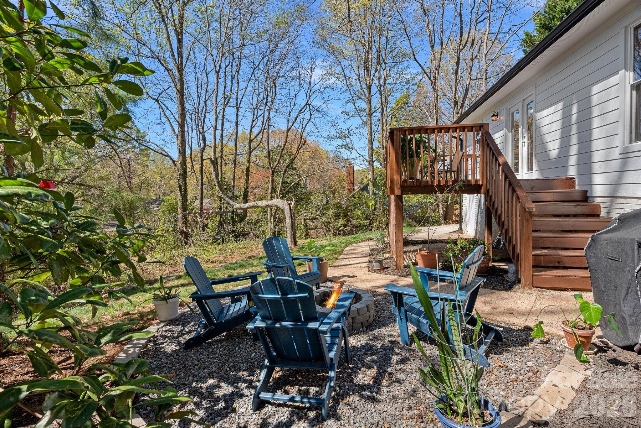 5236 Auburndale Road Charlotte, NC 28205 - Photo 22 of 26 a view of a patio with table and chairs and floor to ceiling window