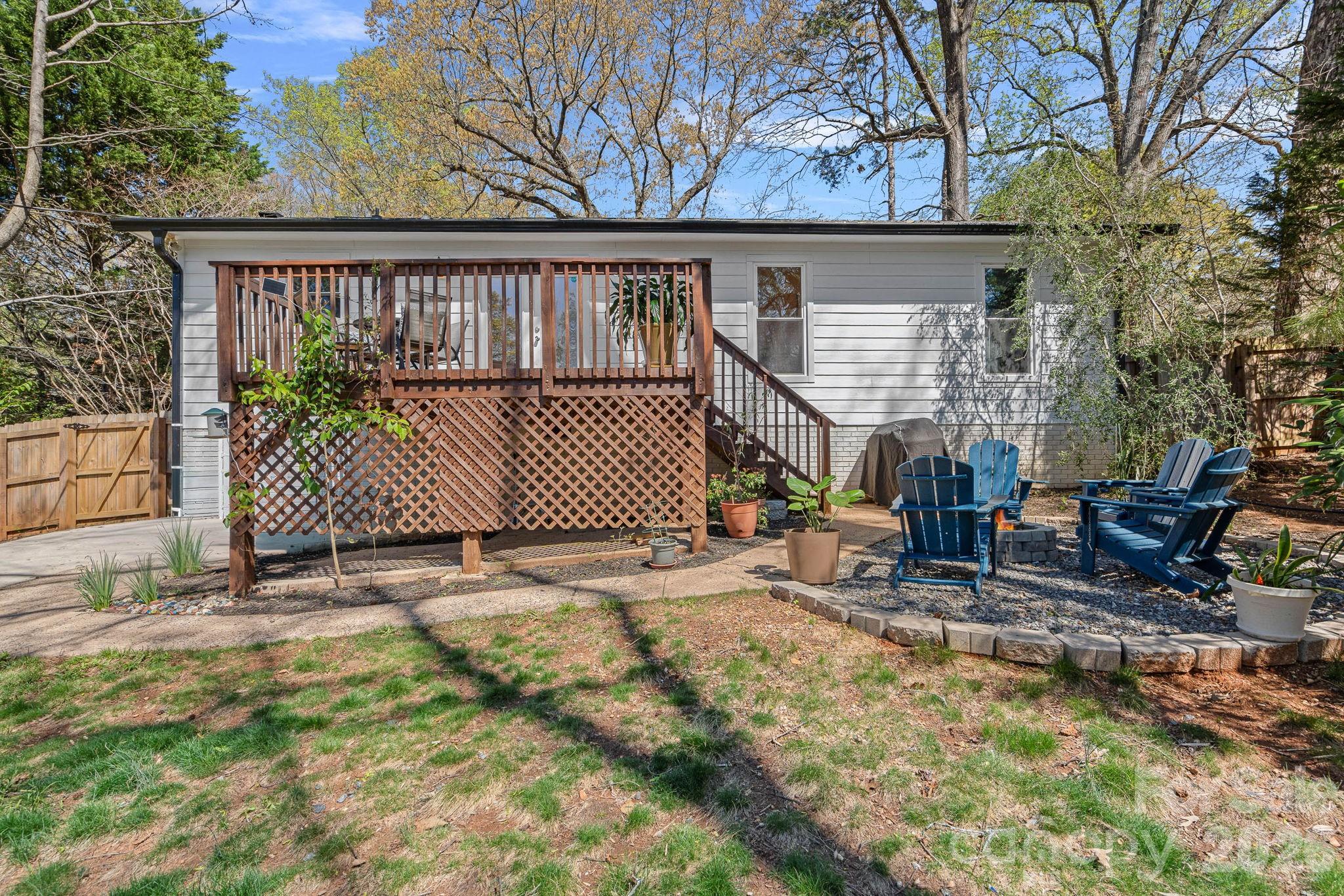 5236 Auburndale Road Charlotte, NC 28205 - Photo 23 of 26 a view of a backyard with a small cabin and wooden fence