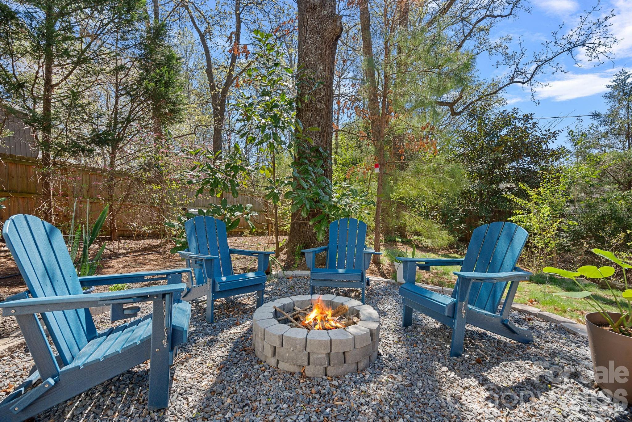 5236 Auburndale Road Charlotte, NC 28205 - Photo 24 of 26 a backyard of a house with table and chairs