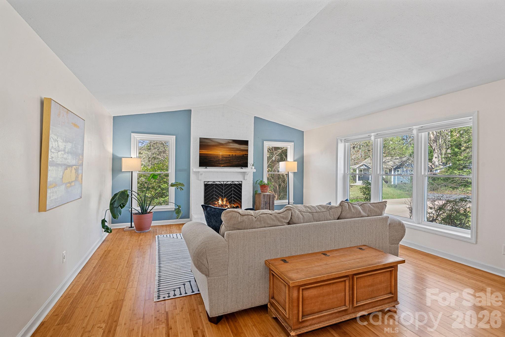 5236 Auburndale Road Charlotte, NC 28205 - Photo 3 of 26 a living room with furniture and a fireplace