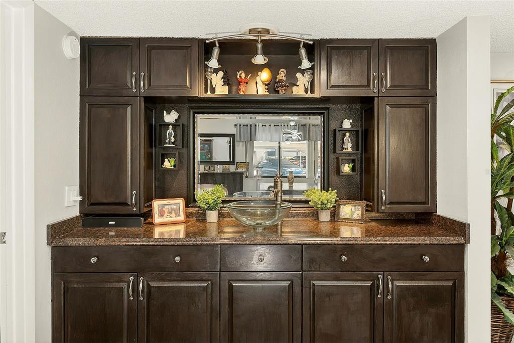 700 Starkey Road, Unit 1216 Largo, FL 33771 - Photo 11 of 32 a kitchen with a sink and cabinets