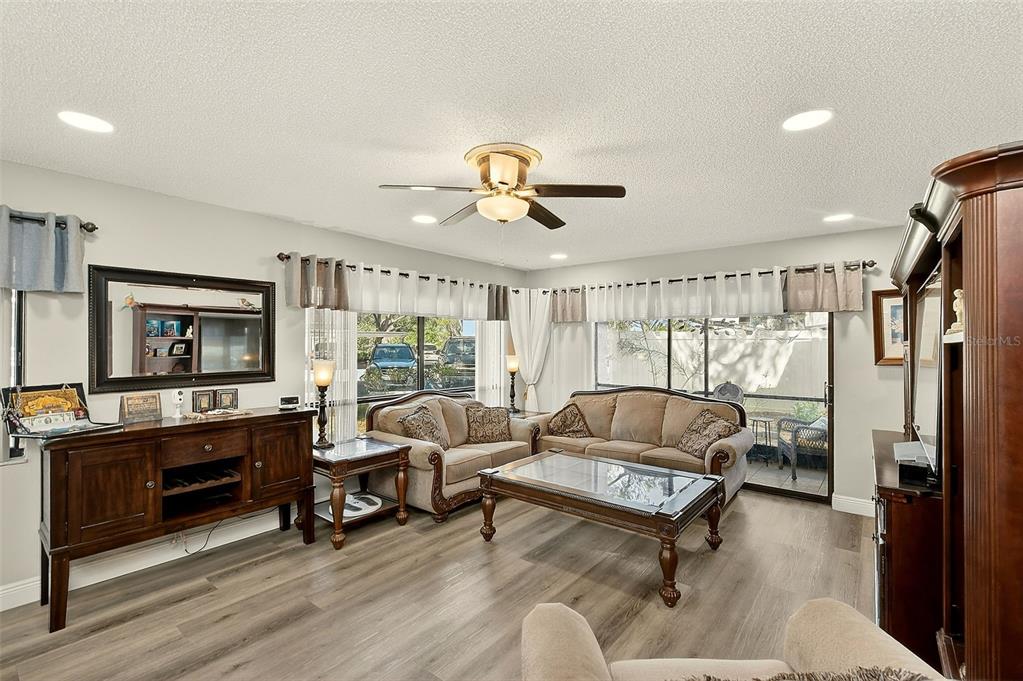 700 Starkey Road, Unit 1216 Largo, FL 33771 - Photo 12 of 32 a living room with furniture and a large window