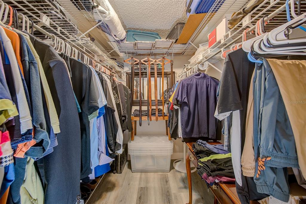 700 Starkey Road, Unit 1216 Largo, FL 33771 - Photo 20 of 32 a view of walk in closet with clothes and shoes