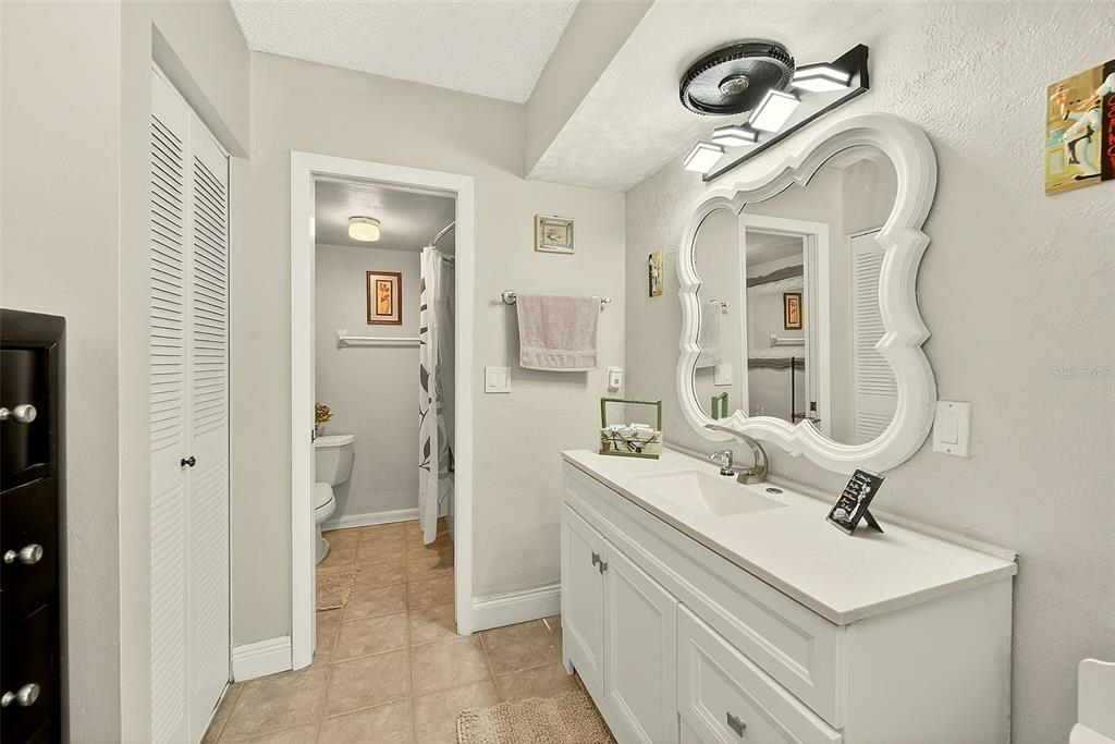 700 Starkey Road, Unit 1216 Largo, FL 33771 - Photo 24 of 32 a bathroom with a sink and a mirror