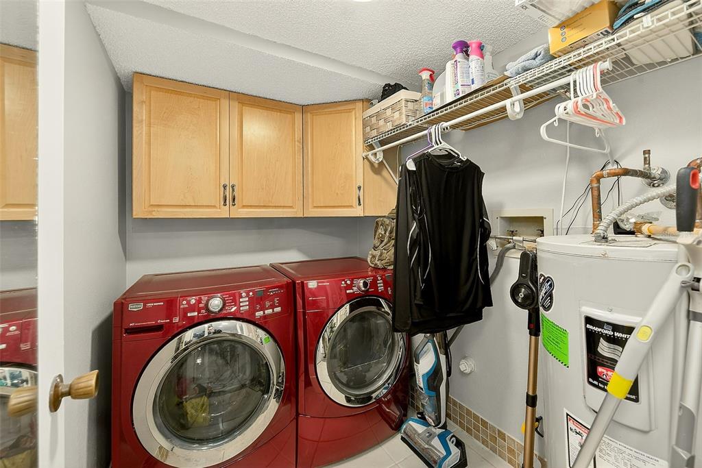 700 Starkey Road, Unit 1216 Largo, FL 33771 - Photo 26 of 32 a utility room with dryer and washer