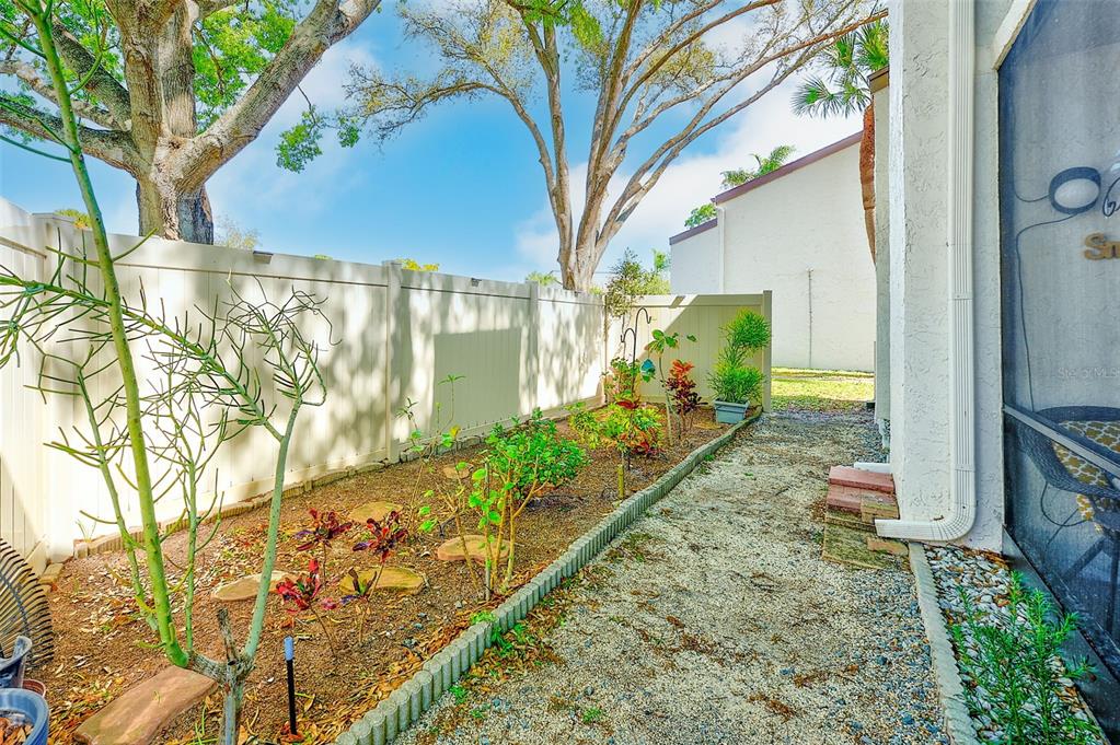 700 Starkey Road, Unit 1216 Largo, FL 33771 - Photo 27 of 32 a view of a pathway with a yard