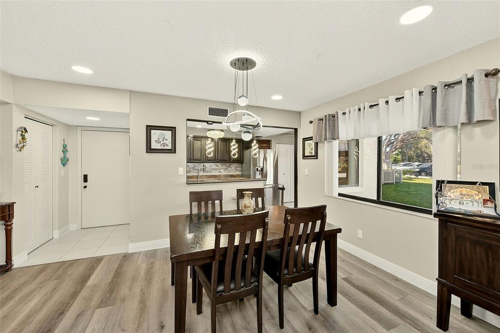 700 Starkey Road, Unit 1216 Largo, FL 33771 - Photo 5 of 32 a dining room with furniture and window