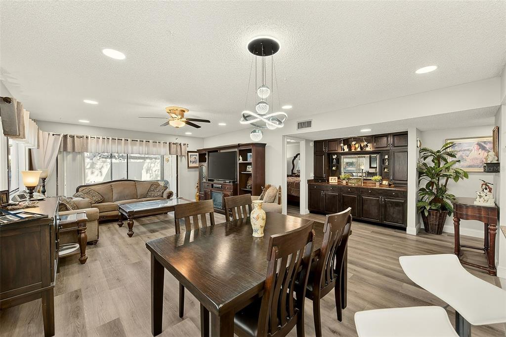 700 Starkey Road, Unit 1216 Largo, FL 33771 - Photo 10 of 32 a view of a dining room with furniture and wooden floor