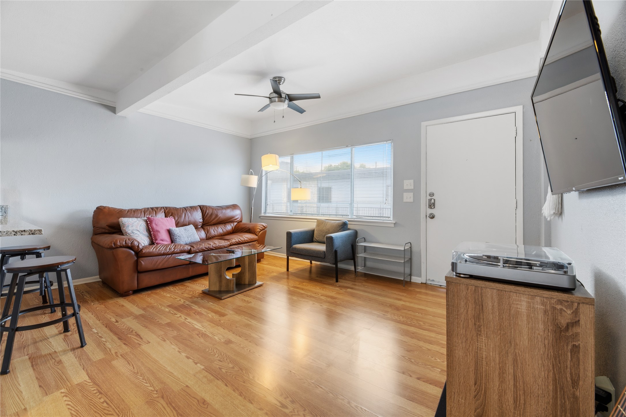 a living room with furniture and a flat screen tv