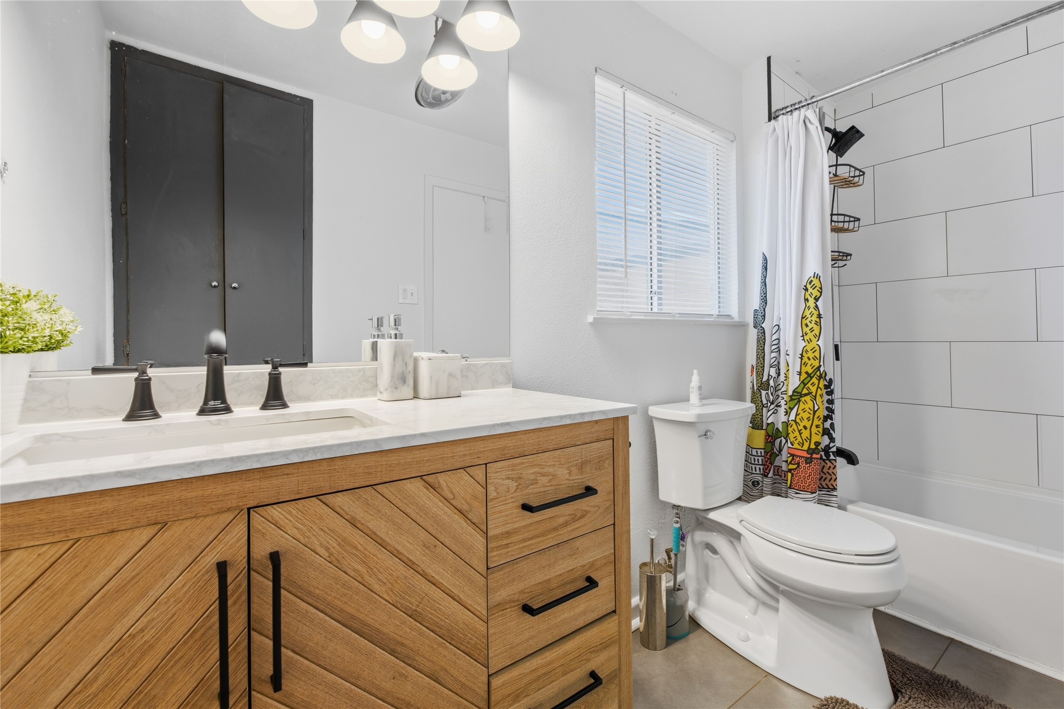 2408 Longview Street, Unit 204 Austin, TX 78705 - Photo 14 of 17 a bathroom with a sink a toilet and shower