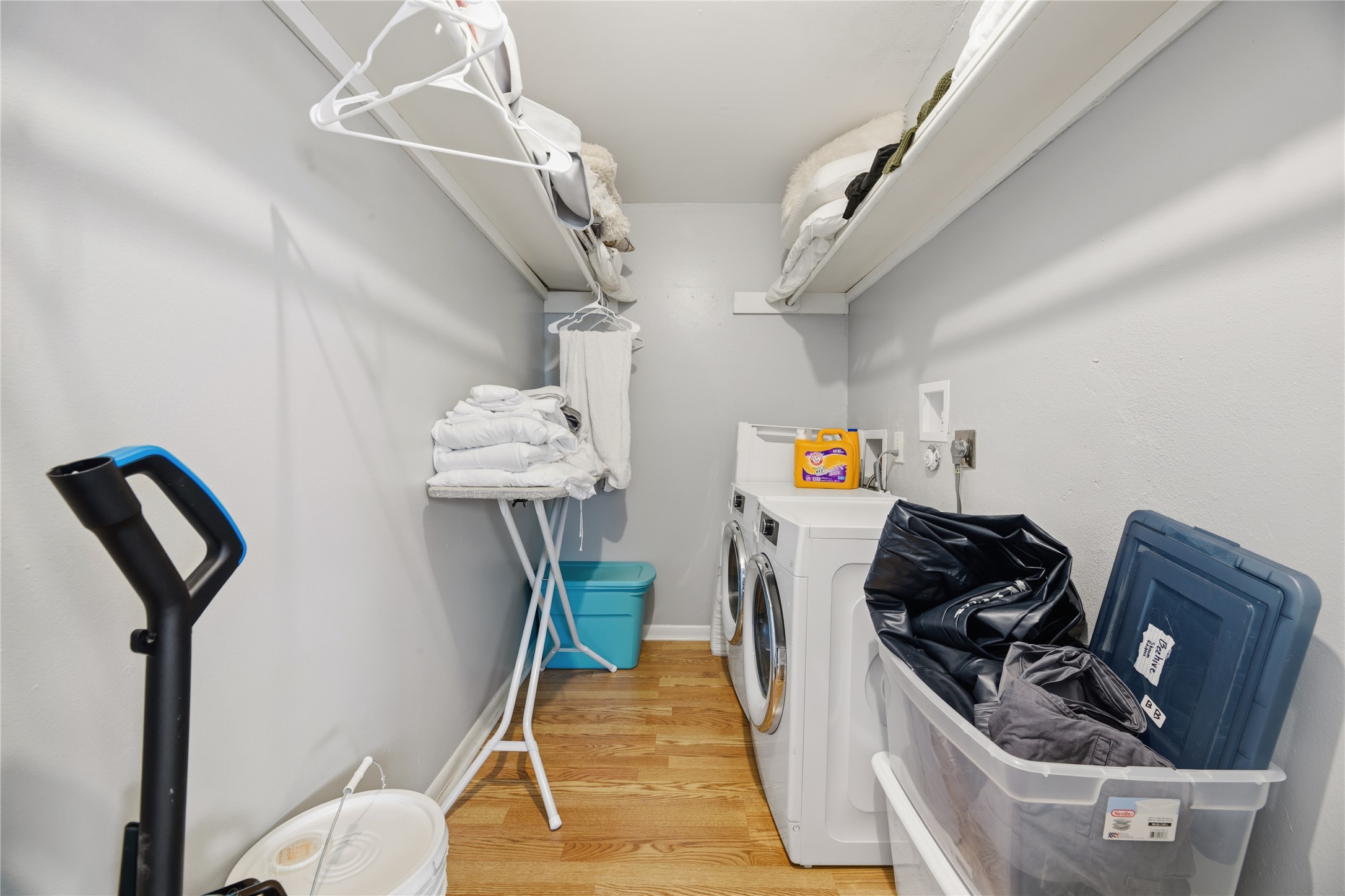 2408 Longview Street, Unit 204 Austin, TX 78705 - Photo 16 of 17 a living room with furniture and a chandelier