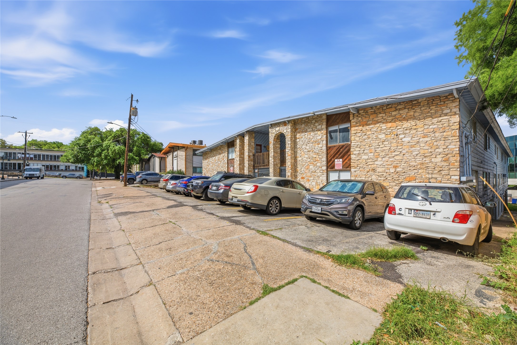 2408 Longview Street, Unit 204 Austin, TX 78705 - Photo 2 of 17 a cars parked on the side of a street
