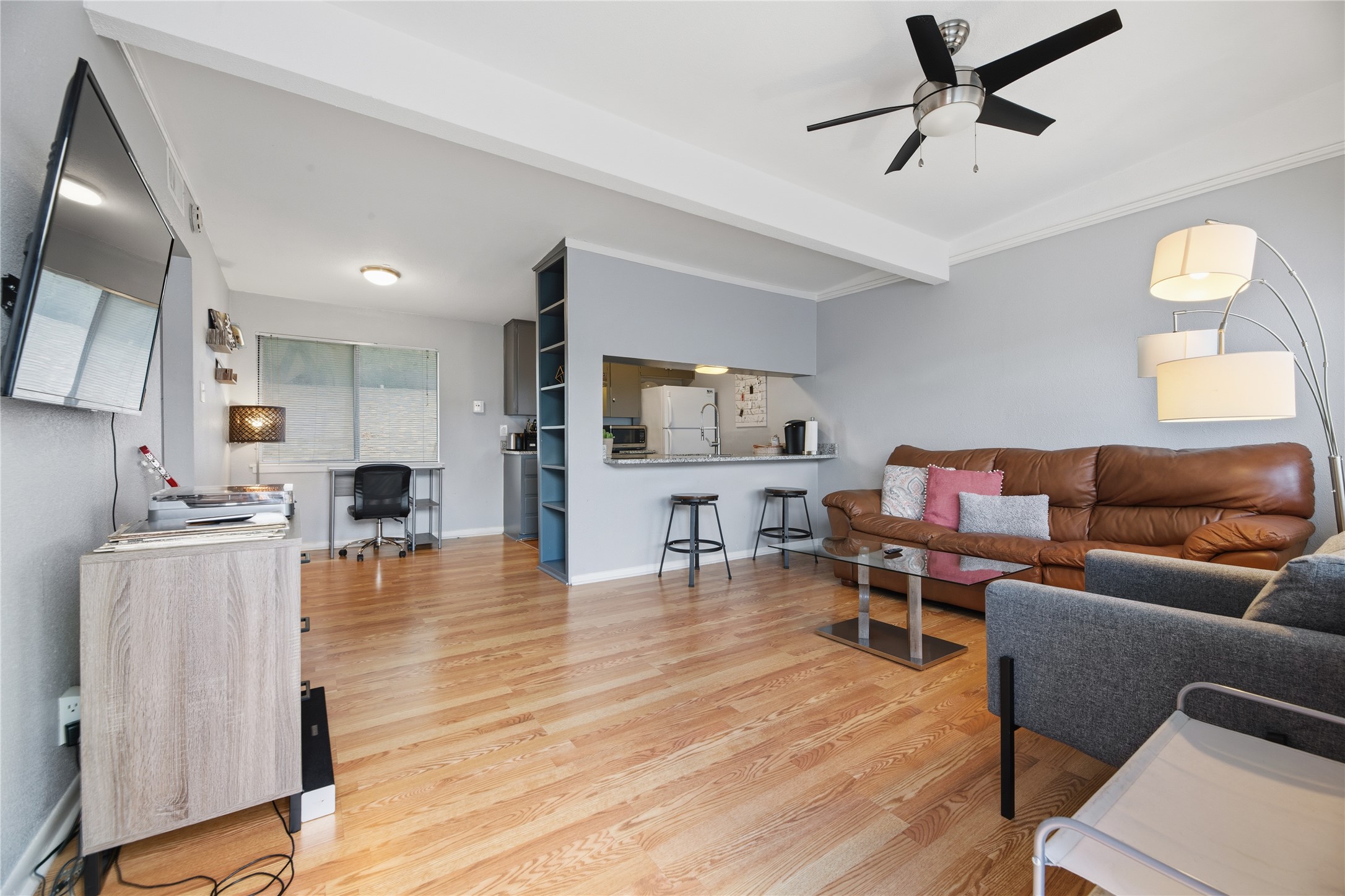 2408 Longview Street, Unit 204 Austin, TX 78705 - Photo 3 of 17 a living room with furniture and a wooden floor