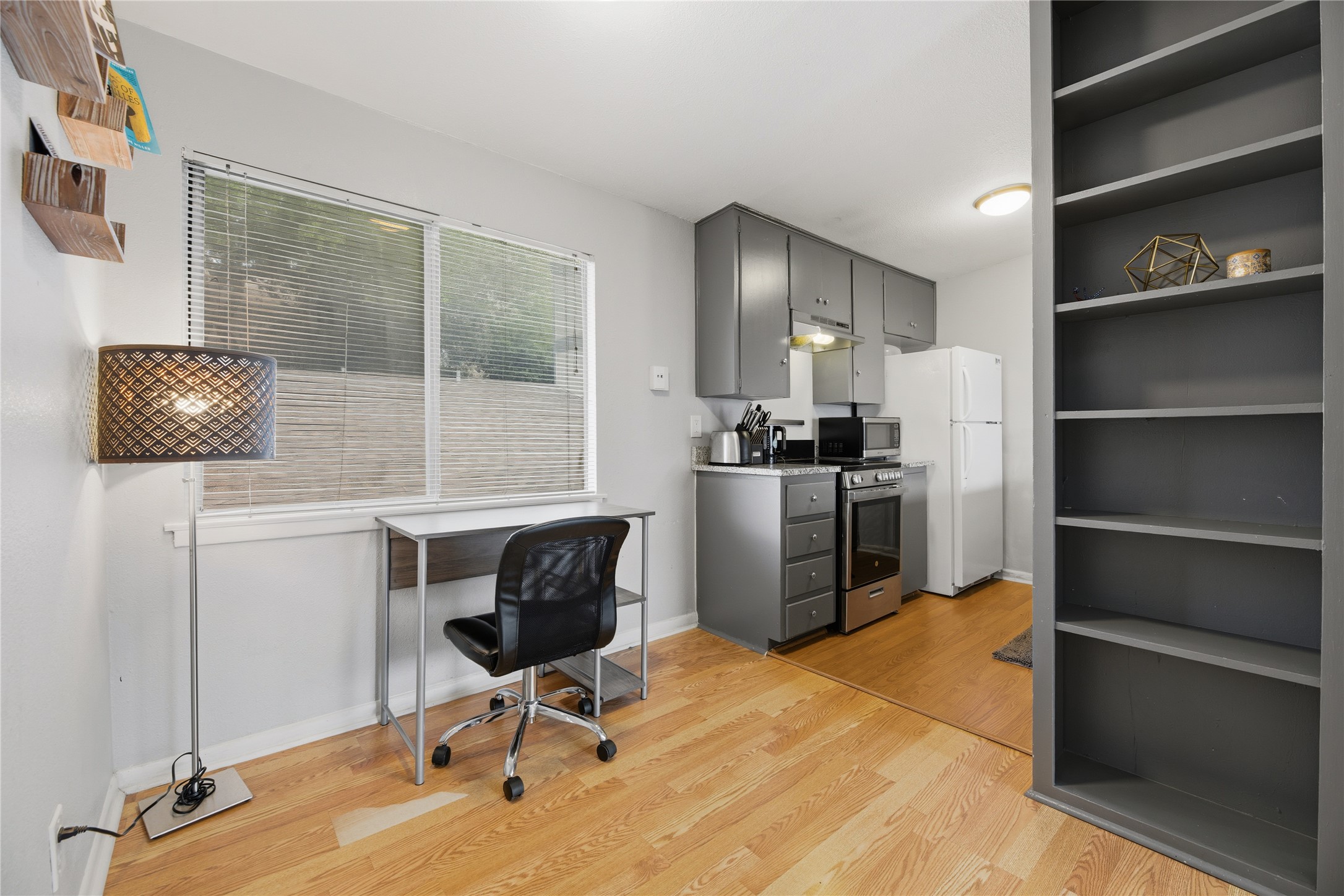 2408 Longview Street, Unit 204 Austin, TX 78705 - Photo 7 of 17 a view of a workspace with furniture and a window