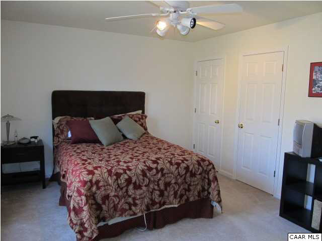 2 Bernardsburg Road Palmyra, VA 22963 - Photo 7 of 16 a bedroom with a bed and a chandelier