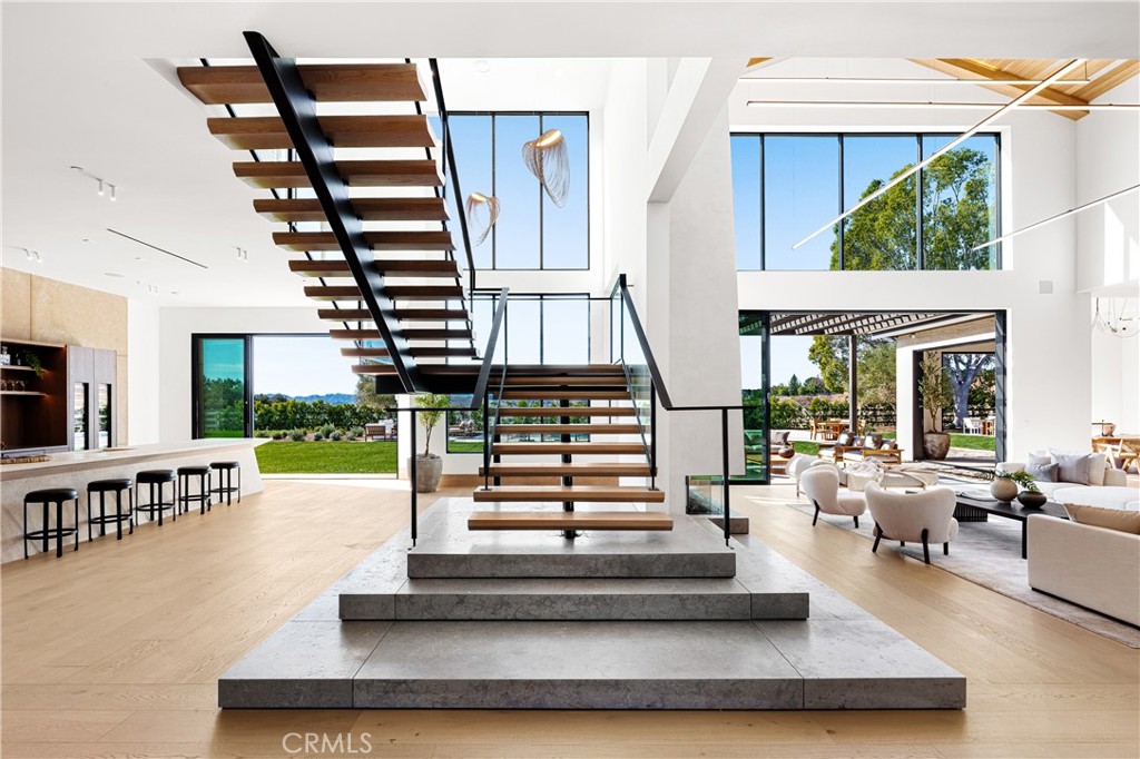 25151 Jim Bridger Road Hidden Hills, CA 91302 - Photo 11 of 32 a view of entryway and hall with wooden floor