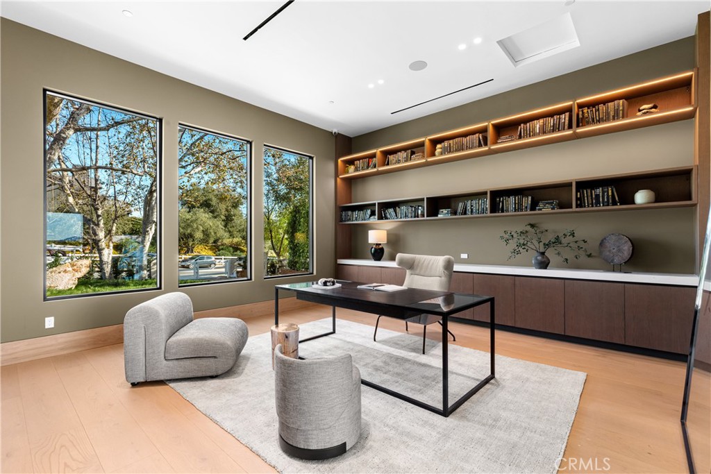 25151 Jim Bridger Road Hidden Hills, CA 91302 - Photo 13 of 32 a living room with furniture and a large window