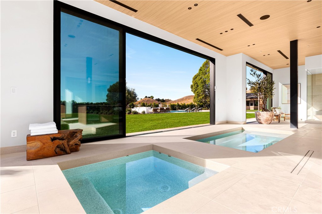 25151 Jim Bridger Road Hidden Hills, CA 91302 - Photo 17 of 32 a building exterior with furniture