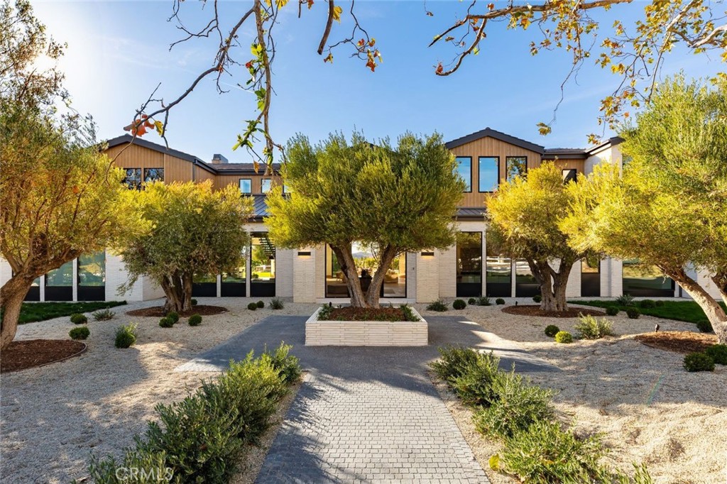 25151 Jim Bridger Road Hidden Hills, CA 91302 - Photo 2 of 32 a front view of a building with street view