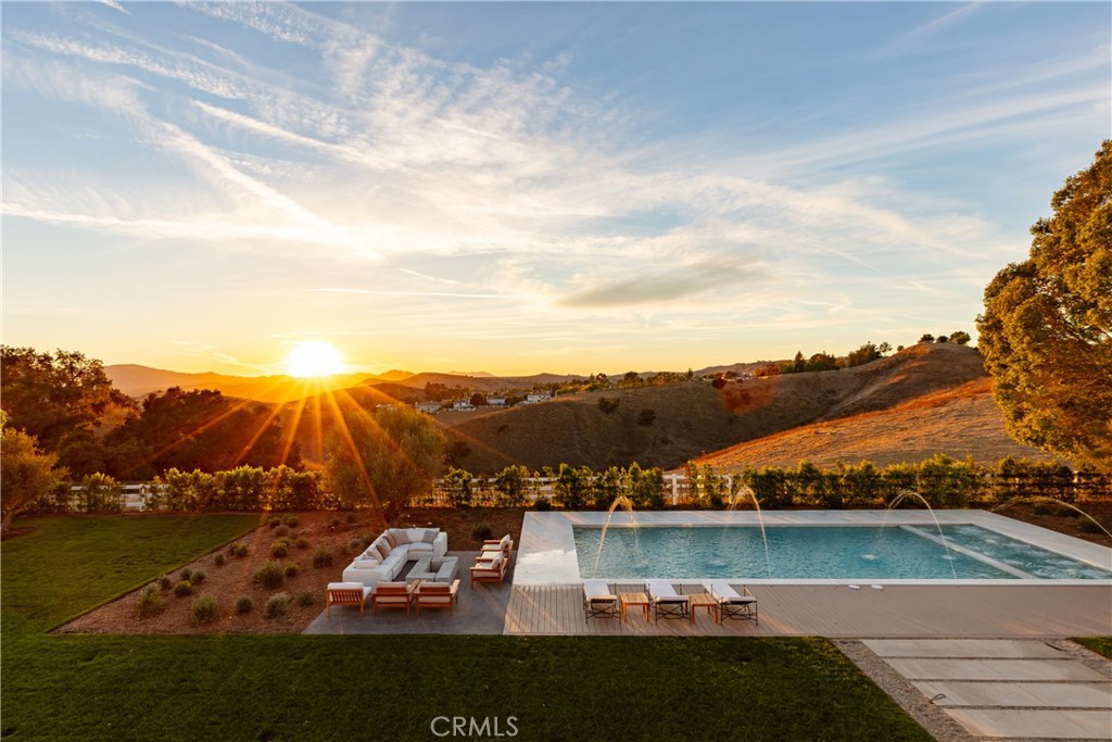 25151 Jim Bridger Road Hidden Hills, CA 91302 - Photo 30 of 32 an aerial view of residential houses with outdoor space and river